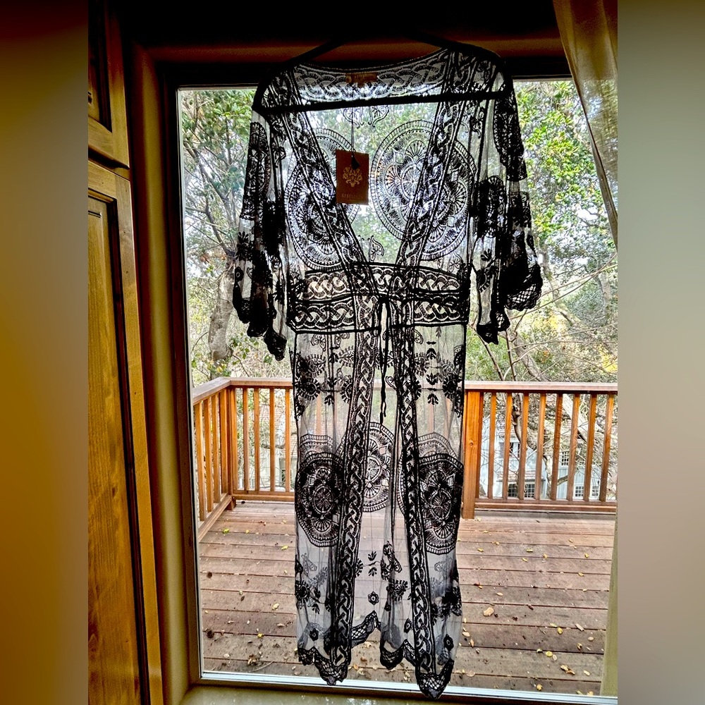 Swimsuit cover up size XS in gray with a tie front. New with tag, never worn.